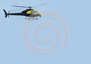 Helicopter Chopper black with blue sky background for editors text copy