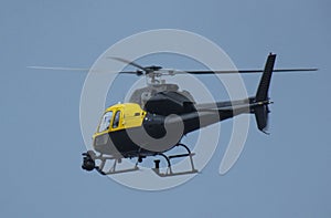 Helicopter Chopper black with blue sky background for editors text copy