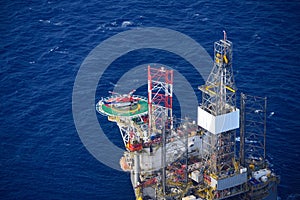 Helicopter embark passenger on the offshore oil rig. photo