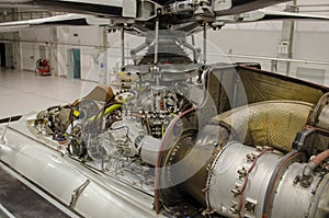 Helicopter engine exposed for maintenance in a Hangar