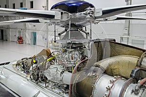 Helicopter engine exposed for maintenance in a Hangar