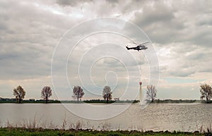 Helicopter exercises with a specialized water bucket