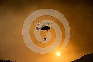 Helicopter fighting fire