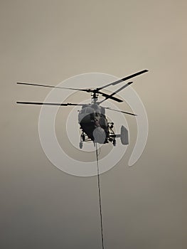 Helicopter fighting fire