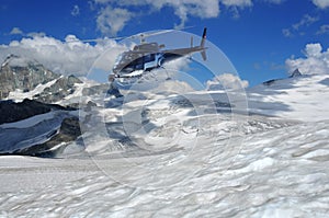 Helicopter filming glaciers and the matterhorn