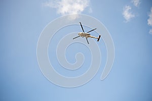 Helicopter in flight against blue sky demonstrating modern rescue and