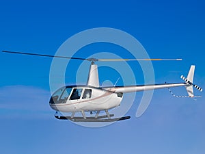 Helicopter flying in blue sky side