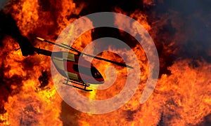 Helicopter flying by a bushfire