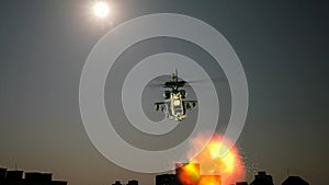 Helicopter flying with explosion in front