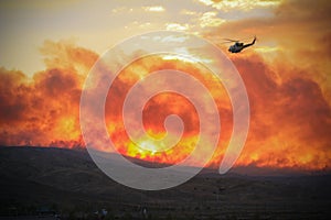 Helicopter flying over fire