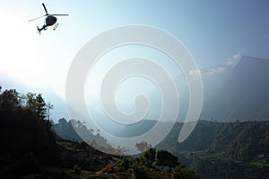 Helicopter flying over green Himalaya mountains, Lukla, Nepal