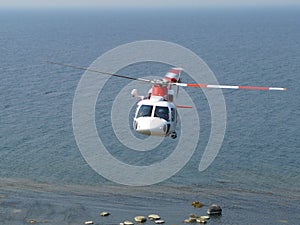 Helicopter flying over sea