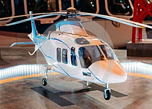 The helicopter on the helipad with a light beacon lights on the platform.