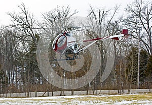 Helicopter landing in field