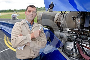 helicopter mechanic posing holding wrench