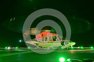 The helicopter night landing on offshore oil rig