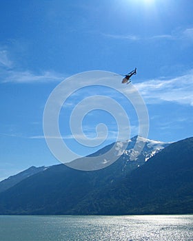 Helicopter Over Bay In Alaska