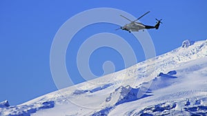 Helicopter over snowy mountain in Iceland