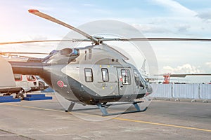 Helicopter parked on the helipad airport behind the fence