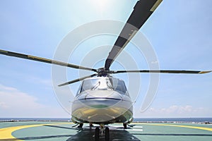 Helicopter parking landing on offshore platform. Helicopter transfer crews or passenger to work in offshore oil and gas industry