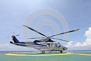 Helicopter parking landing on offshore platform. Helicopter transfer crews or passenger to work in offshore oil and gas industry