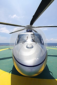 Helicopter parking landing on offshore platform. Helicopter transfer crews or passenger to work in offshore oil and gas industry