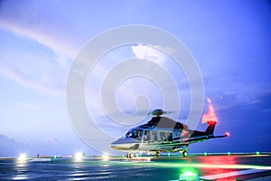 Helicopter parking landing on offshore platform. Helicopter transfer crews or passenger to work in offshore oil and gas industry