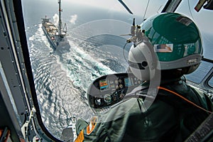 Helicopter pilot inspecting an offshore platform during an aerial overflight