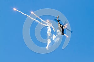 Helicopter releases flares on the airshow