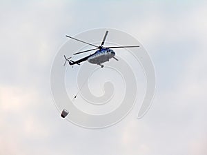 A helicopter returns from extinquishing a fire