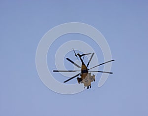 Helicopter with rotator blades in flight over Berkeley California