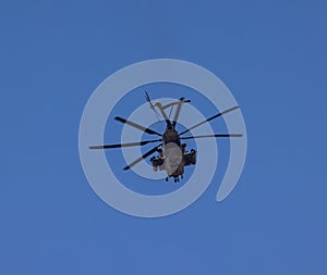 Helicopter with rotator blades in flight over Berkeley California