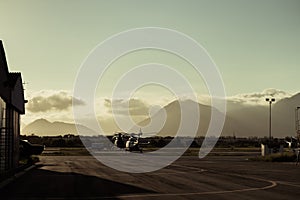 Helicopter on the runway at sunset.