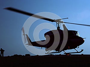 Silhouette of a Helicopter Landing.