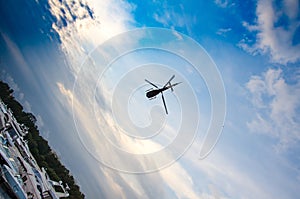 Helicopter in the sky with clouds