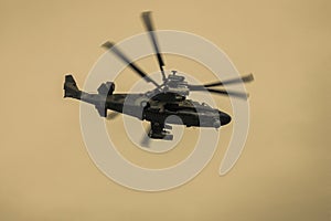 Helicopter with spinning blades photo
