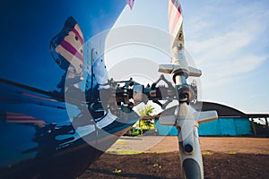 Helicopter tail rotor selective focus or Tail rotor of transport helicopter under hangar background.