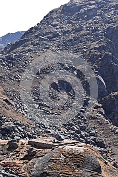 Helicopter on a takeoff platform between the mountains of Nepal`s Langtang National Park