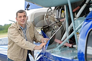 Helicopter technician looking at camera