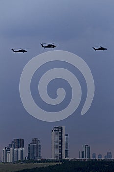 Helicopters on blue sky with clouds