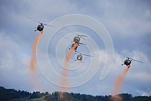 Helicopters with red mist