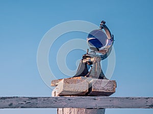 Heliograph measuring device on the sky background. The device records the duration of sunshine and is used at weather stations photo