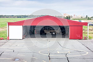 Helipad and open hangar with a helicopter