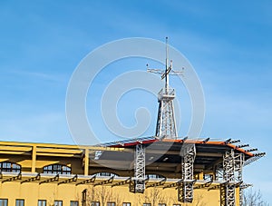 Helipad on the roof of a building with a blue background