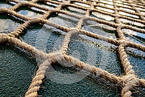 The helipad of the ship. A snow net made of hemp rope for landing a helicopter on the move of an Arctic vessel. Helipad on a ship