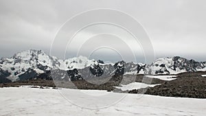 Helipad on snow mountain panorama and helicopter in New Zealand.