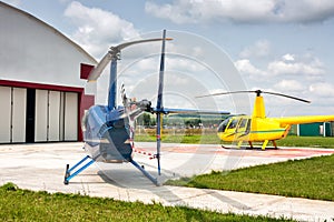 Helipad with two small helicopters