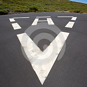 Heliport triangle white soil painted sign photo