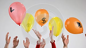 Helium balloons as symbol of unreliable currency.