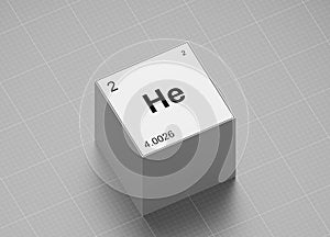 Helium element symbol, from periodic table on white cube on milimeter paper